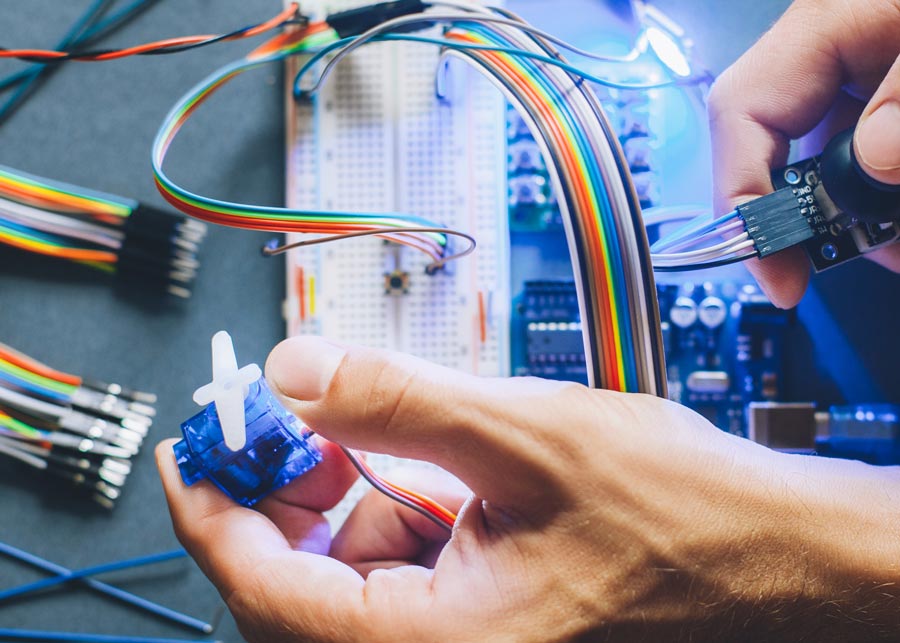 man with wires and circuit board